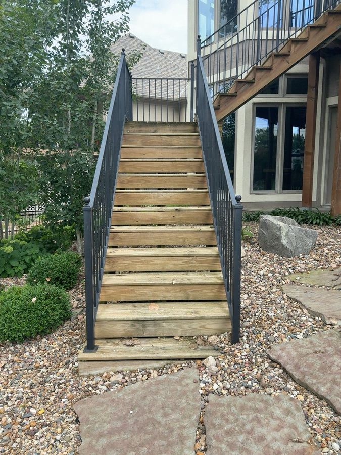 Weathered gray wood staircase and railing before staining