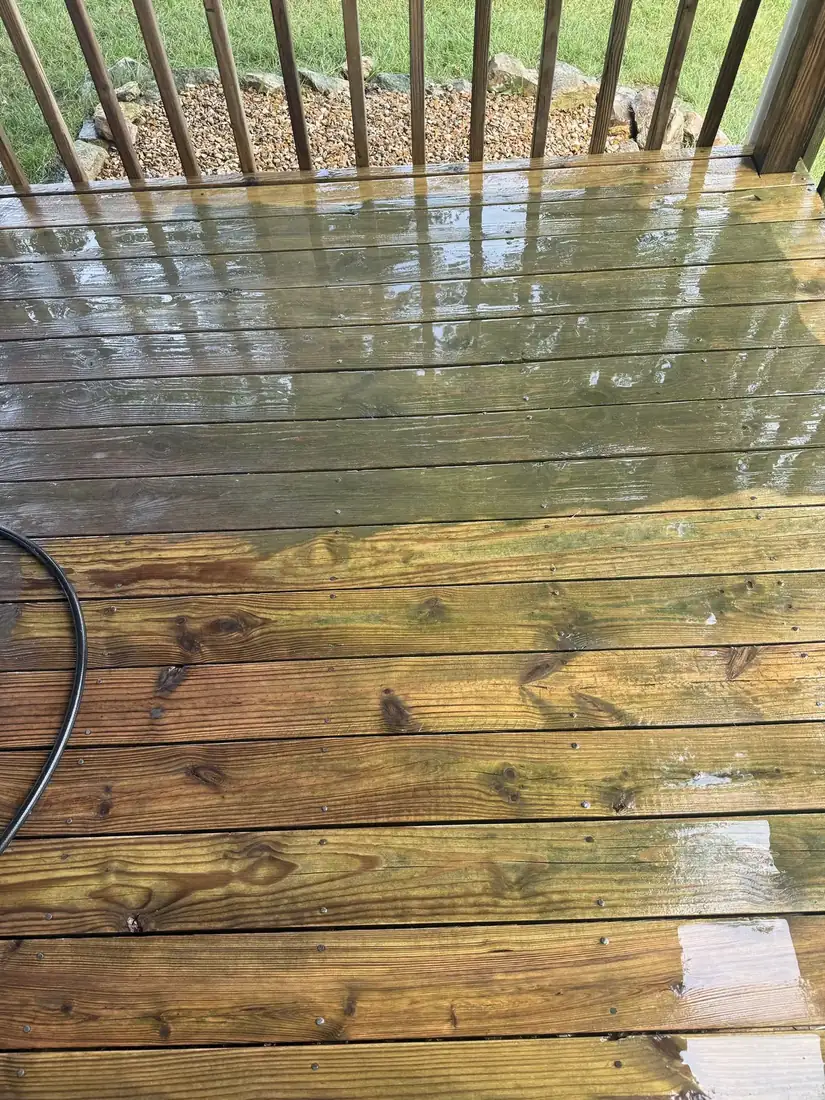 Wood deck half cleaned, showing gray weathered boards next to bright clean wood