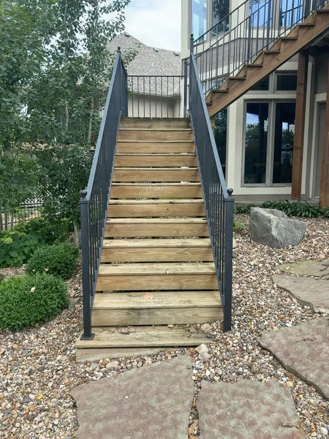 Weathered gray wood staircase before staining