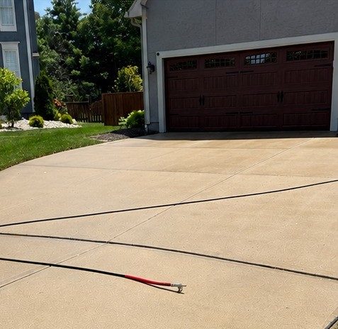 Driveway restored to like-new condition after Elite Pressure Pros cleaning
